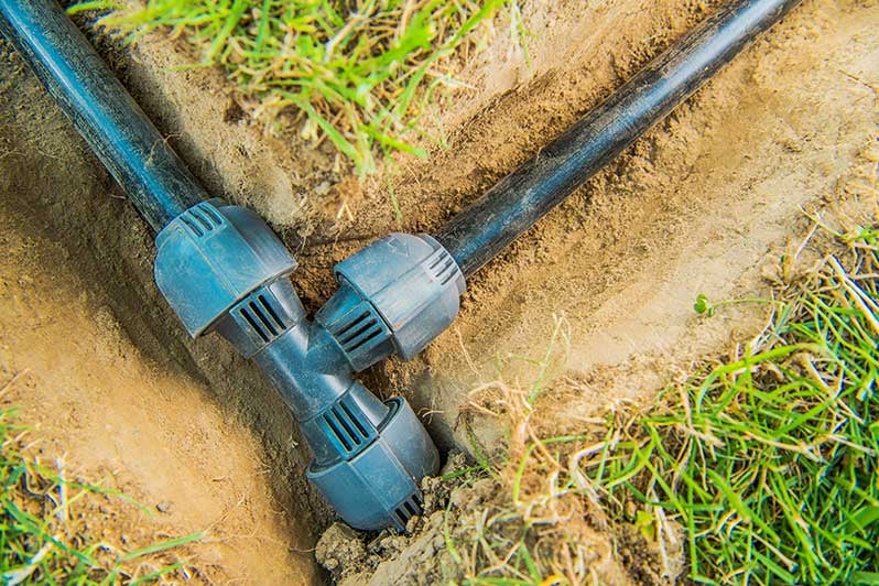 irrigation-pipes-in-the-ground-with-grass