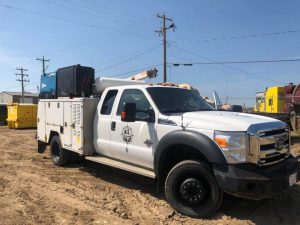 Diesel air compressor on service truck
