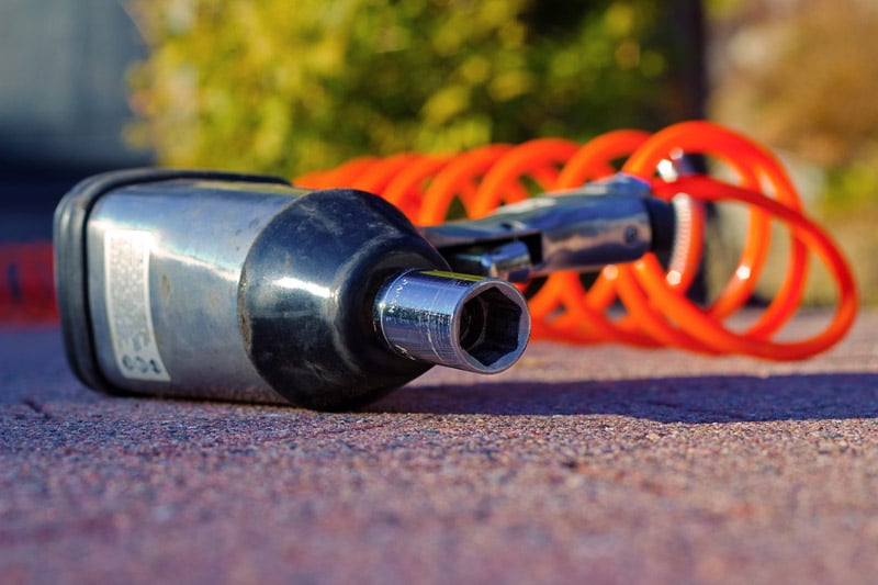 Impact wrench laying on ground