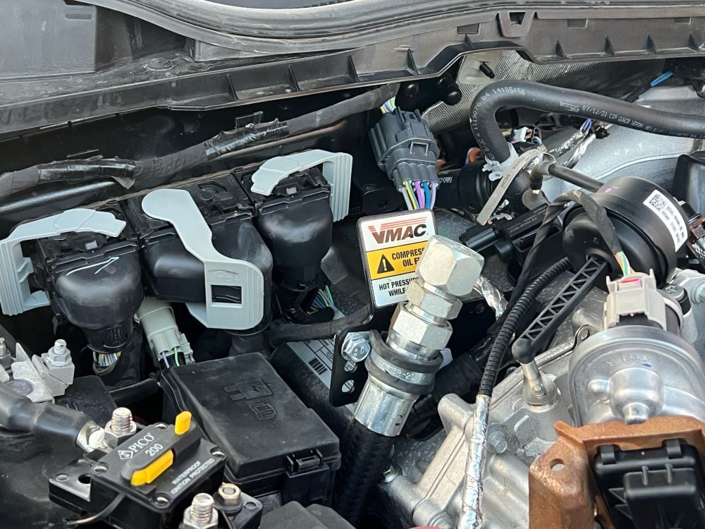 DTM70-H oil refill installed under hood of Ford F-550