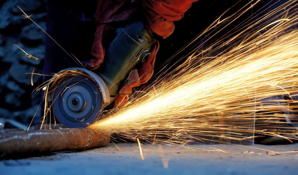 Die grinder sparking while cutting metal