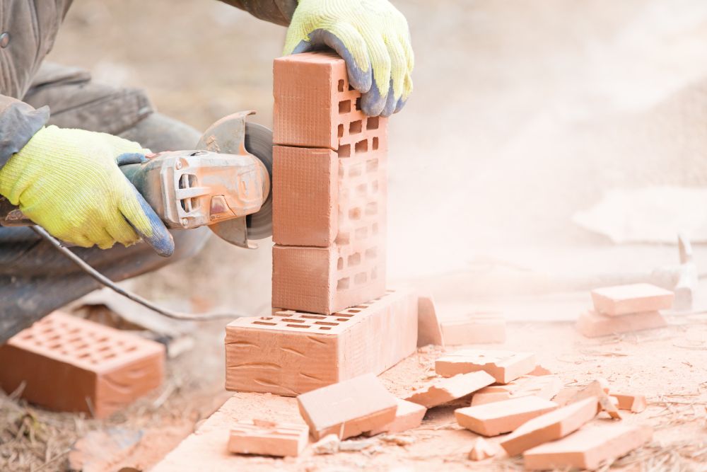 Angle grinder cuts through bricks