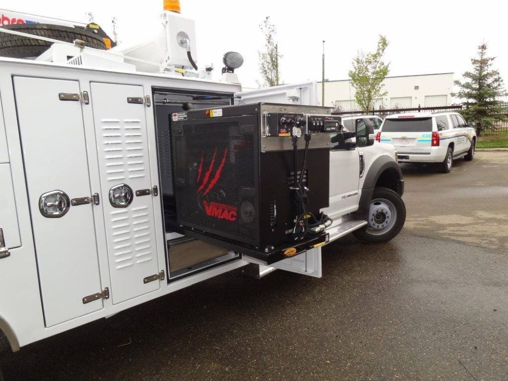 VMAC Multifunction installed on rollers in service truck cargo bed