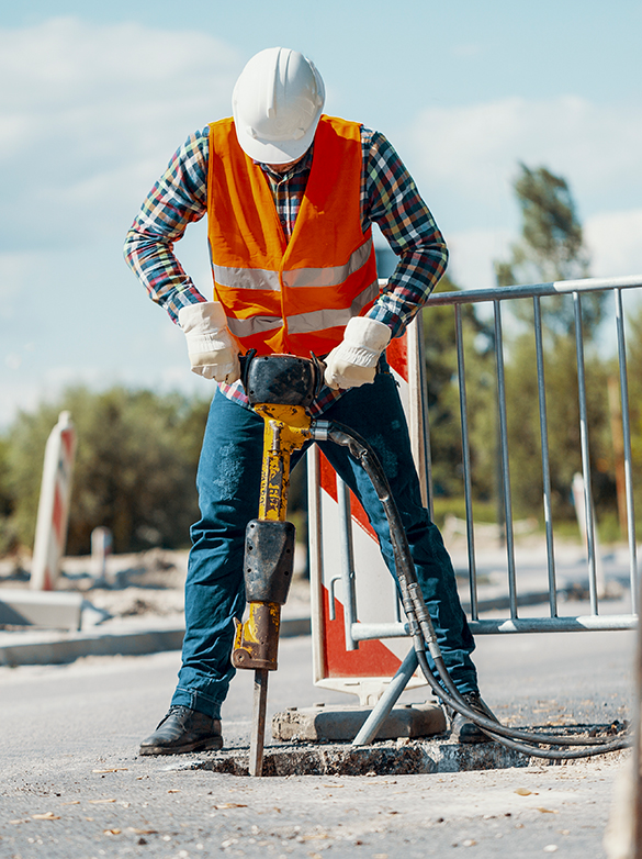 worker-in-reflective-vest-with-drill-repairing-str-2026-01-05-06-22-34-utc